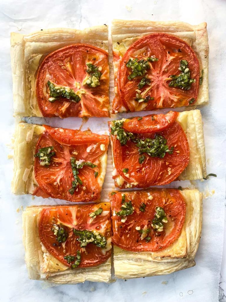 roasted tomato tart with brie and basil cut into pieces